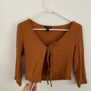 Brownish with slit on the chest top